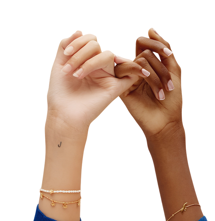 Two hands with manicured nails linked in a pinky promise